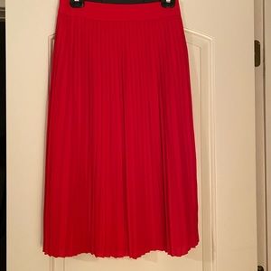 High waisted red pleated skirt